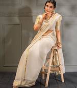 Classic off-white silk blend saree with golden zari border