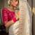 Ivory silk blend saree with pastel floral woven motifs