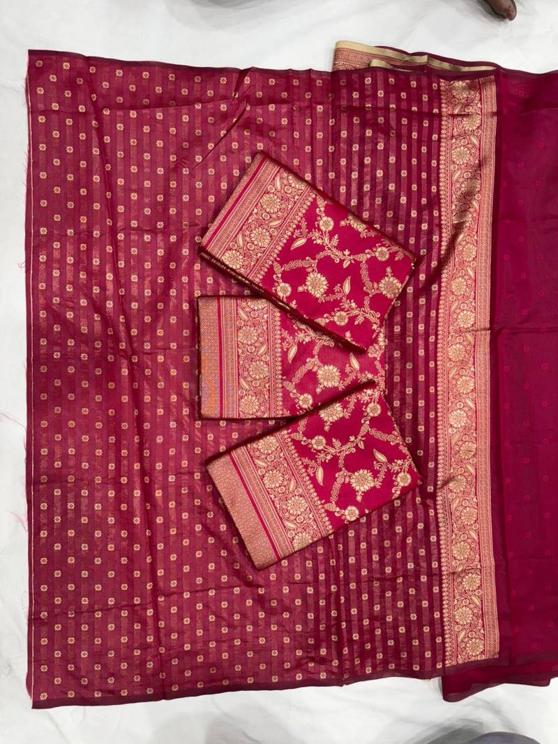 Magenta pink silk blend saree with heavy gold floral weaving