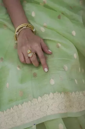 Pastel mint green silk blend saree with silver motifs