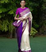 Cream silk blend saree with royal purple zari border