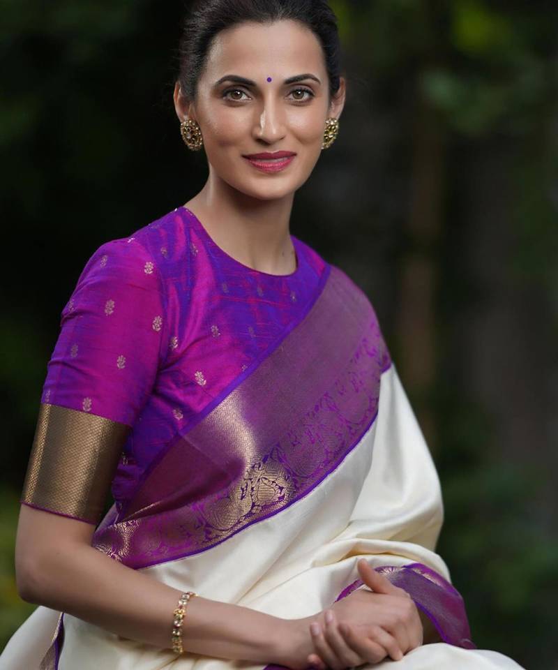 Cream silk blend saree with royal purple zari border