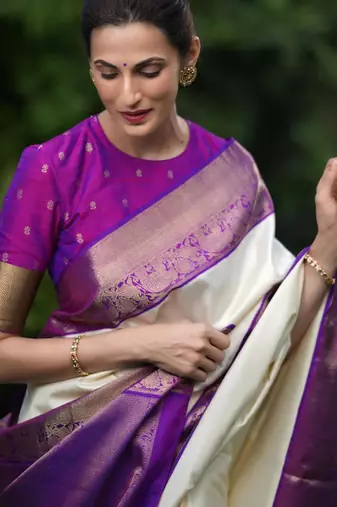 Cream silk blend saree with royal purple zari border