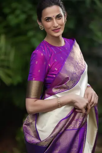 Cream silk blend saree with royal purple zari border