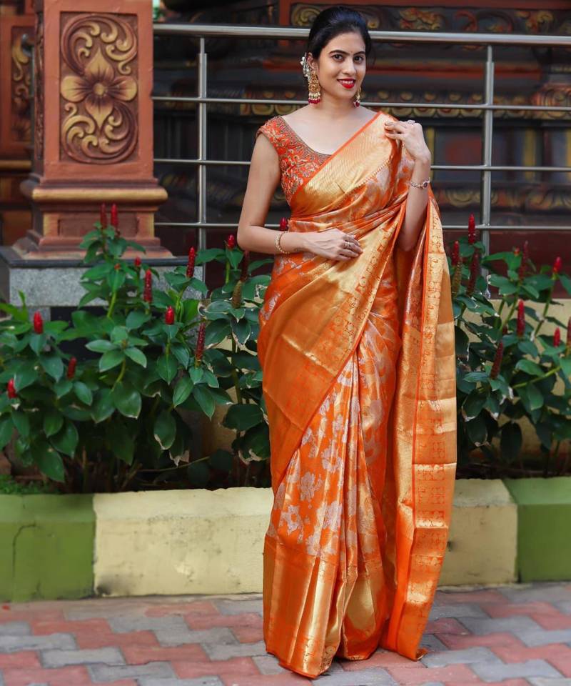 Radiant orange silk blend saree with exquisite gold brocade weave