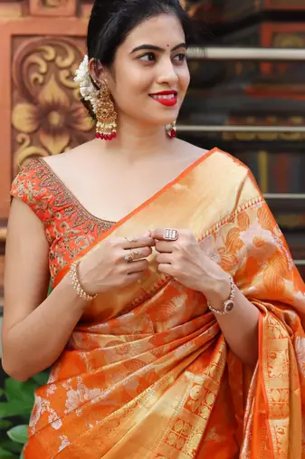Radiant orange silk blend saree with exquisite gold brocade weave