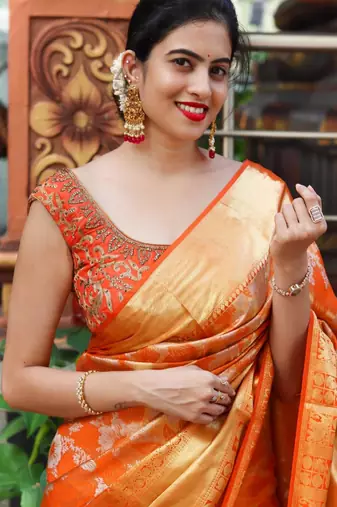 Radiant orange silk blend saree with exquisite gold brocade weave