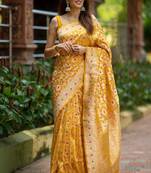 Luminous yellow silk blend saree with multicolored woven butti