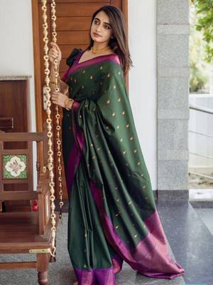 Deep bottle green silk blend saree with magenta border accents 1