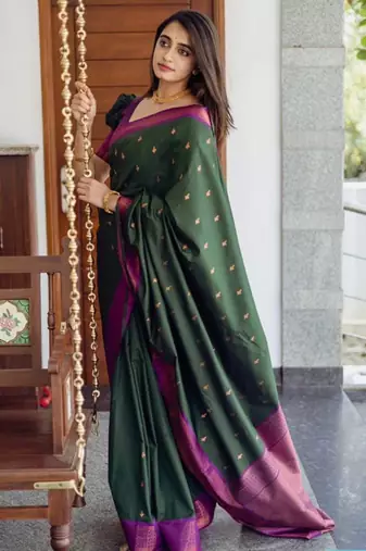 Deep bottle green silk blend saree with magenta border accents