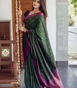 Deep bottle green silk blend saree with magenta border accents