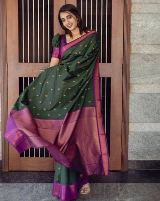 Deep bottle green silk blend saree with magenta border accents 4