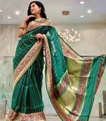 Green striped silk blend saree with ornate maroon border