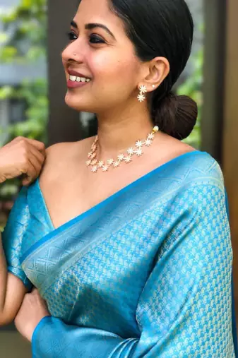 Shimmering cerulean blue silk blend saree with diamond weave