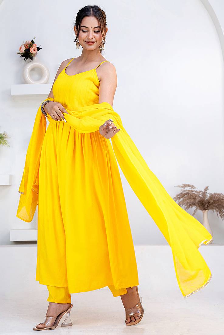 Yellow pintuck solid rayon stitched sleevless flared pant suit set