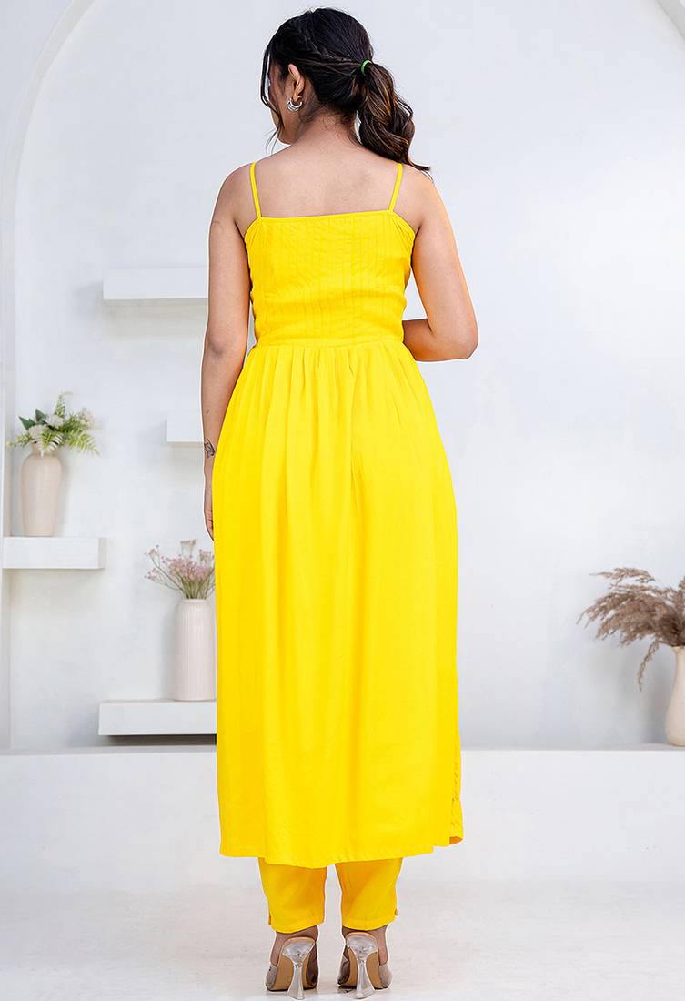 Yellow pintuck solid rayon stitched sleevless flared pant suit set
