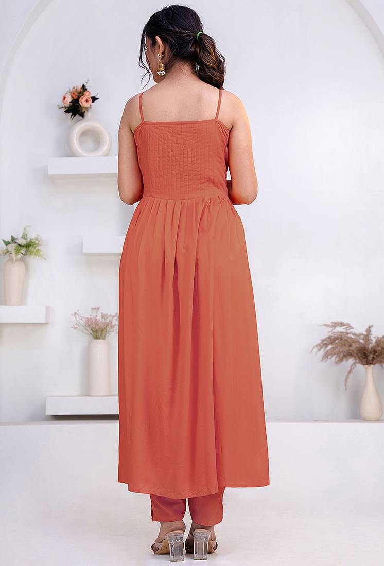 Peach pintuck solid rayon stitched sleevless flared pant suit set