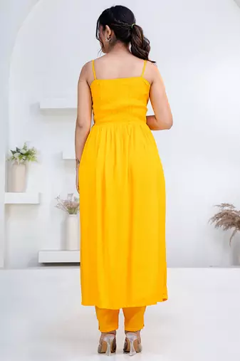 Mustard pintuck solid rayon stitched sleevless flared pant suit set