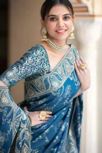 Teal blue silk blend saree with silver floral vines