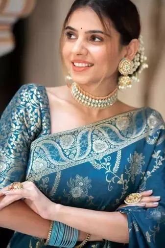 Teal blue silk blend saree with silver floral vines