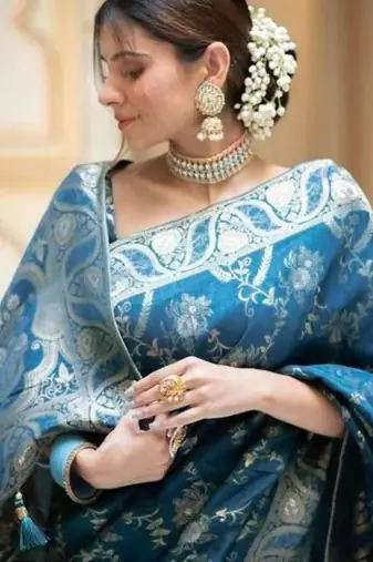 Teal blue silk blend saree with silver floral vines