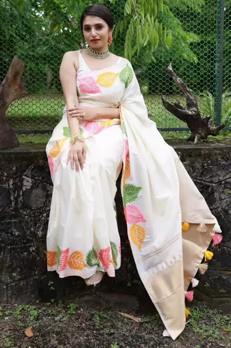 Off-white silk blend saree with colorful leaf motifs