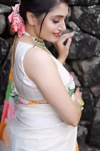 Off-white silk blend saree with colorful leaf motifs