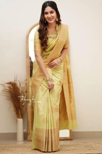 Lime green silk blend saree with golden leaf motifs