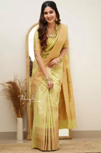Lime green silk blend saree with golden leaf motifs