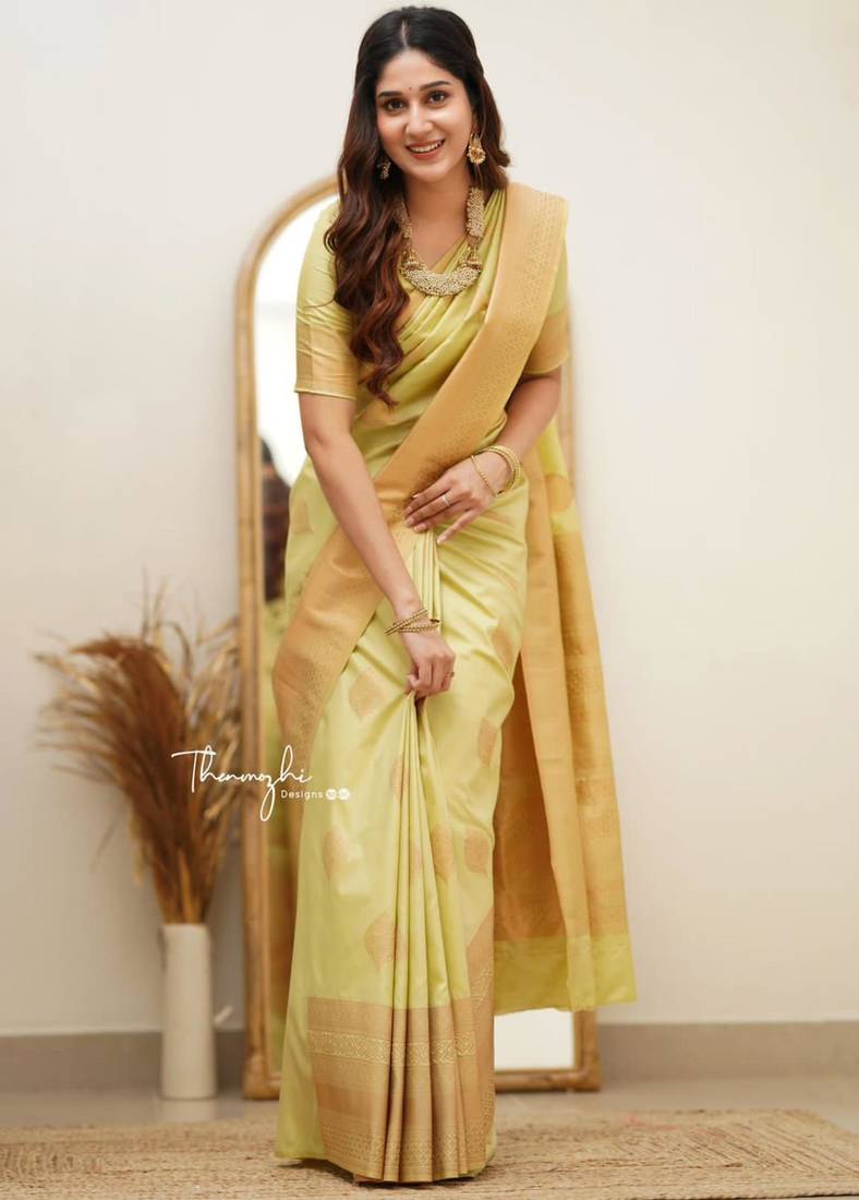 Lime green silk blend saree with golden leaf motifs