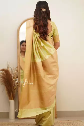 Lime green silk blend saree with golden leaf motifs