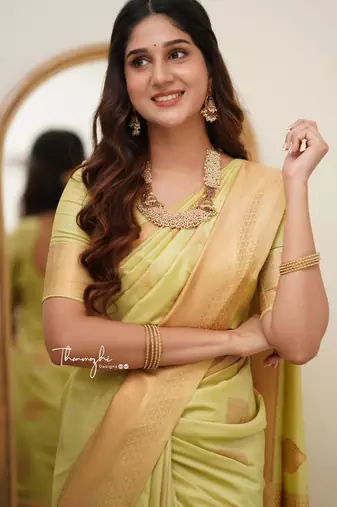 Lime green silk blend saree with golden leaf motifs