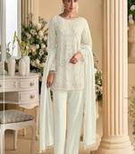 White palazzo set with beadwork and sequins.