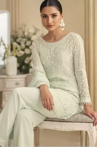 White palazzo set with beadwork and sequins.