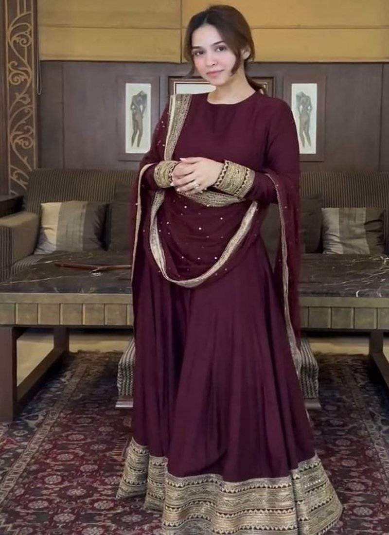 Deep maroon tiered gown with sequin detail