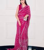 Pink georgette saree with sequins, thread & dori work paired with unstitched japan satin blouse