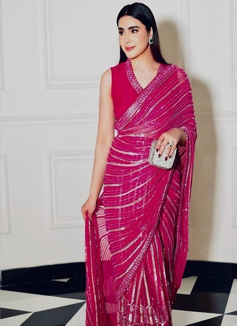 Pink georgette saree with sequins, thread & dori work paired with unstitched japan satin blouse