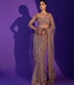 Light brown heart-stealing net saree with sequins, dori & zari work