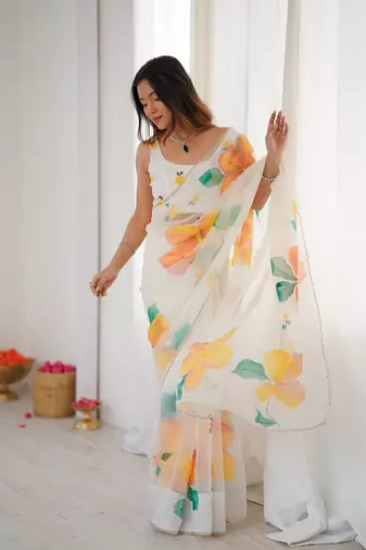 White motif taby silk embellished with beautiful floral print saree set