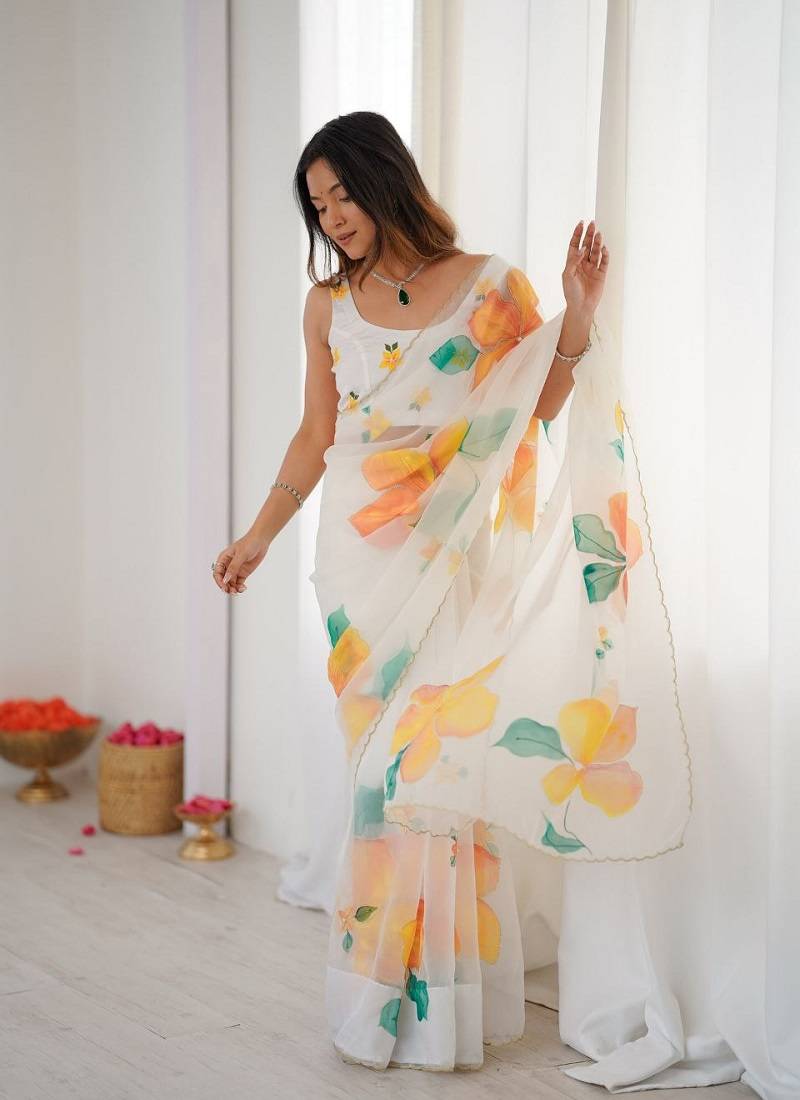 White motif taby silk embellished with beautiful floral print saree set