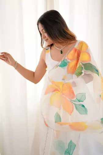 White motif taby silk embellished with beautiful floral print saree set