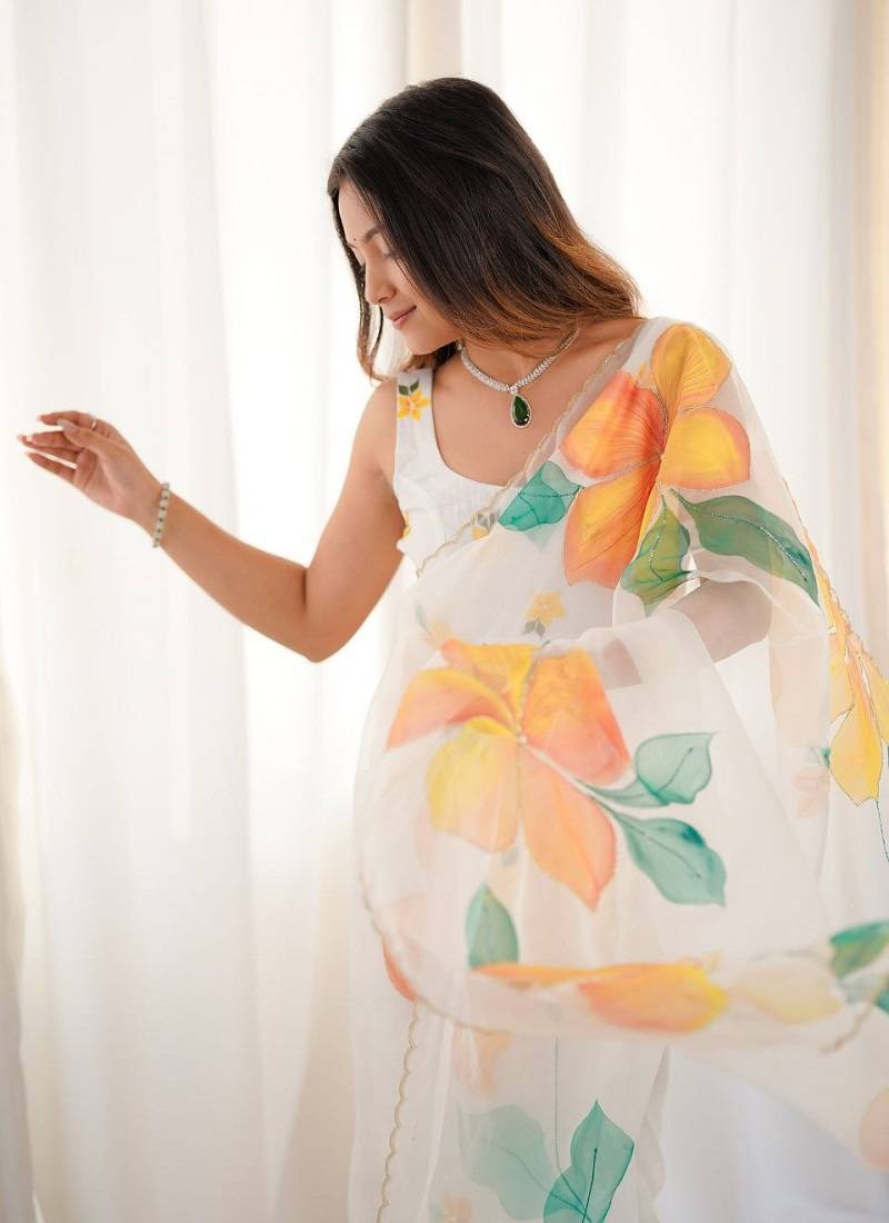 White motif taby silk embellished with beautiful floral print saree set