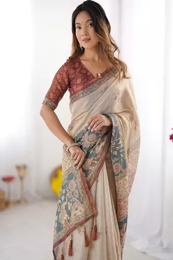 Beige handloom cotton saree with maroon blouse and multicolor royal procession pallu