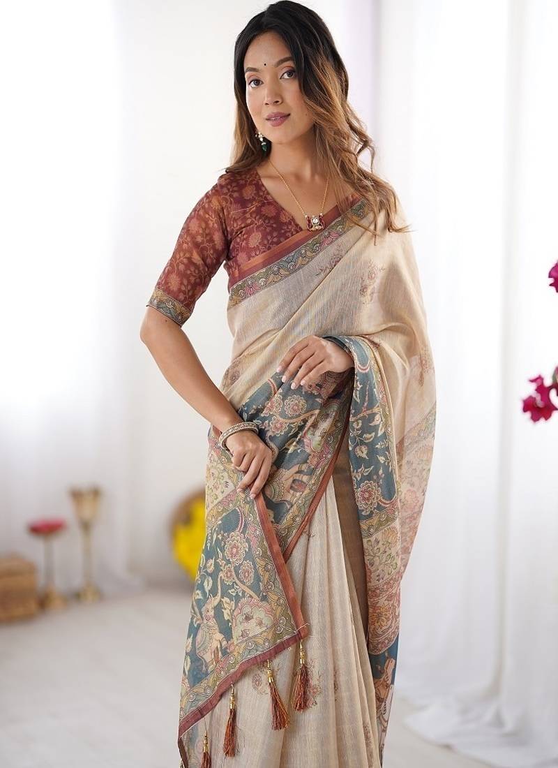 Beige handloom cotton saree with maroon blouse and multicolor royal procession pallu