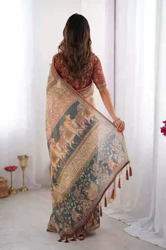Beige handloom cotton saree with maroon blouse and multicolor royal procession pallu