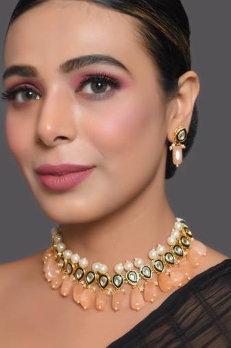 Kundan necklace set with pearls and peach drops