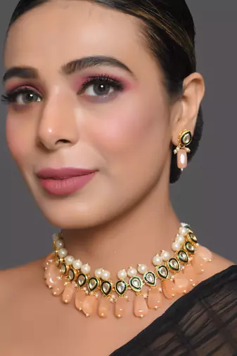 Kundan necklace set with pearls and peach drops