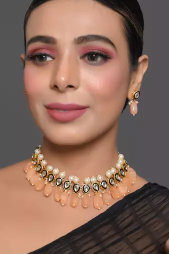 Kundan necklace set with pearls and peach drops