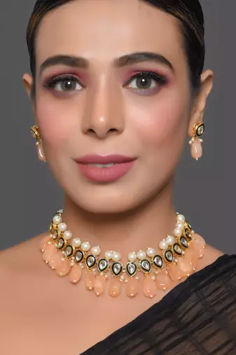 Kundan necklace set with pearls and peach drops