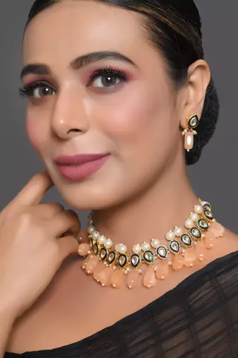 Kundan necklace set with pearls and peach drops